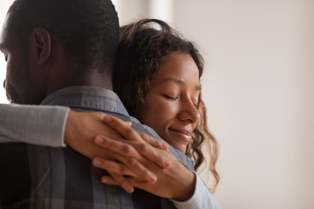 a man and woman hugging