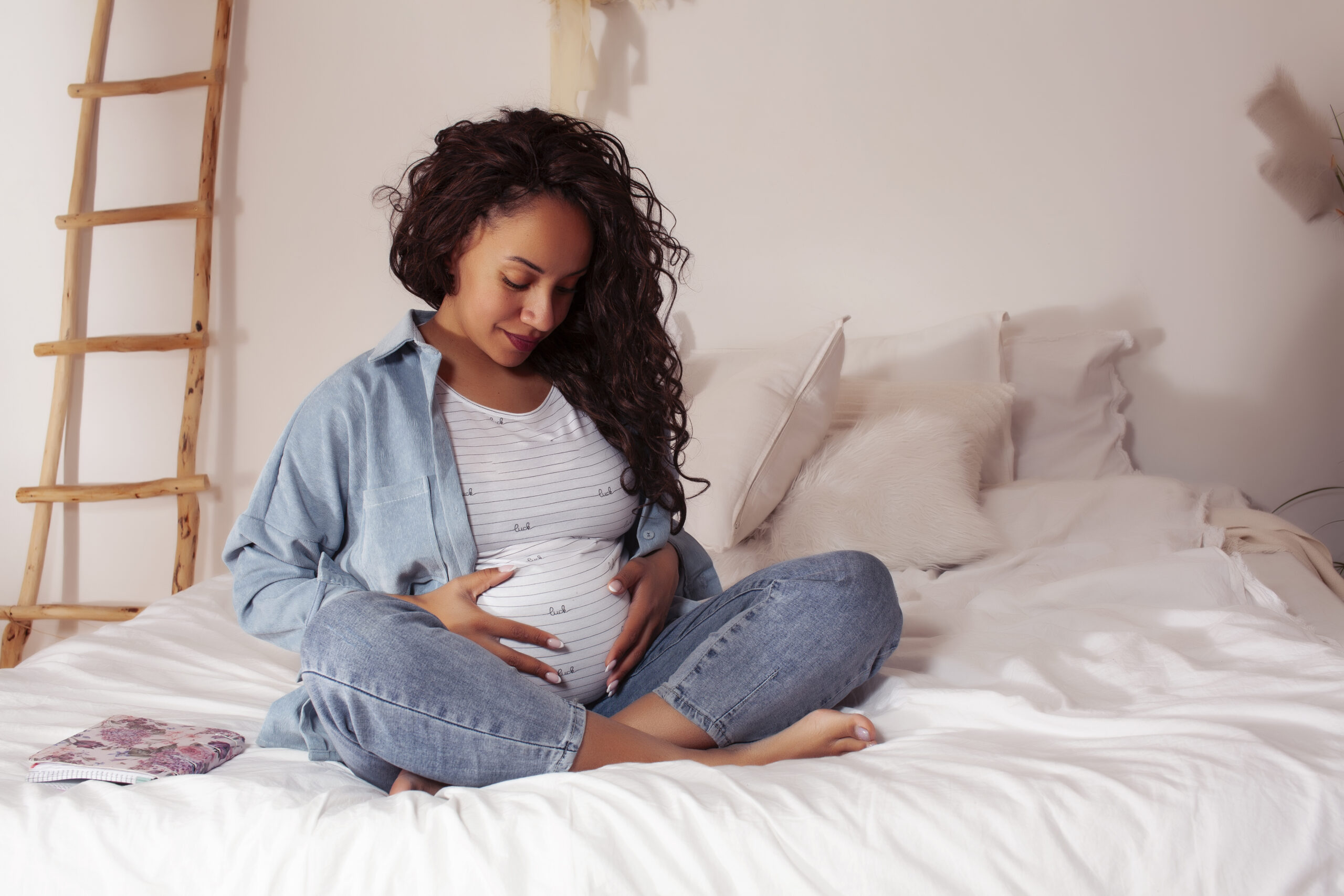 woman holding her pregnant belly
