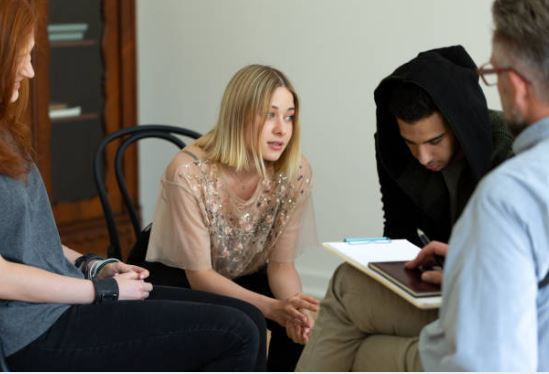 woman sitting in a support group