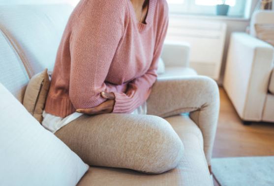 woman holding her stomach