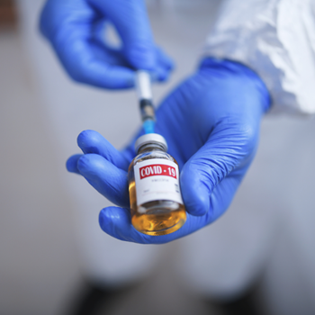covid-19 vaccination bottle with syringe 